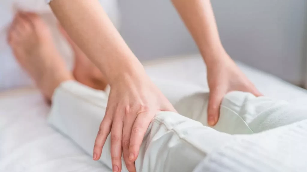 Doctor Examining Womans Knees