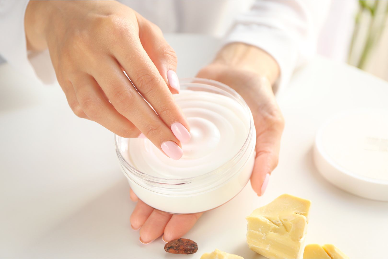 A woman holds a jar of cream for her arthritic knee.